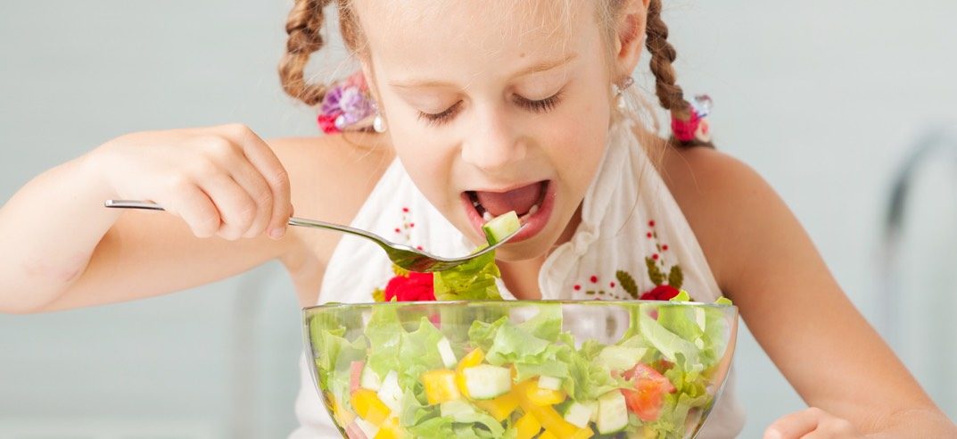 Girl eating salad
